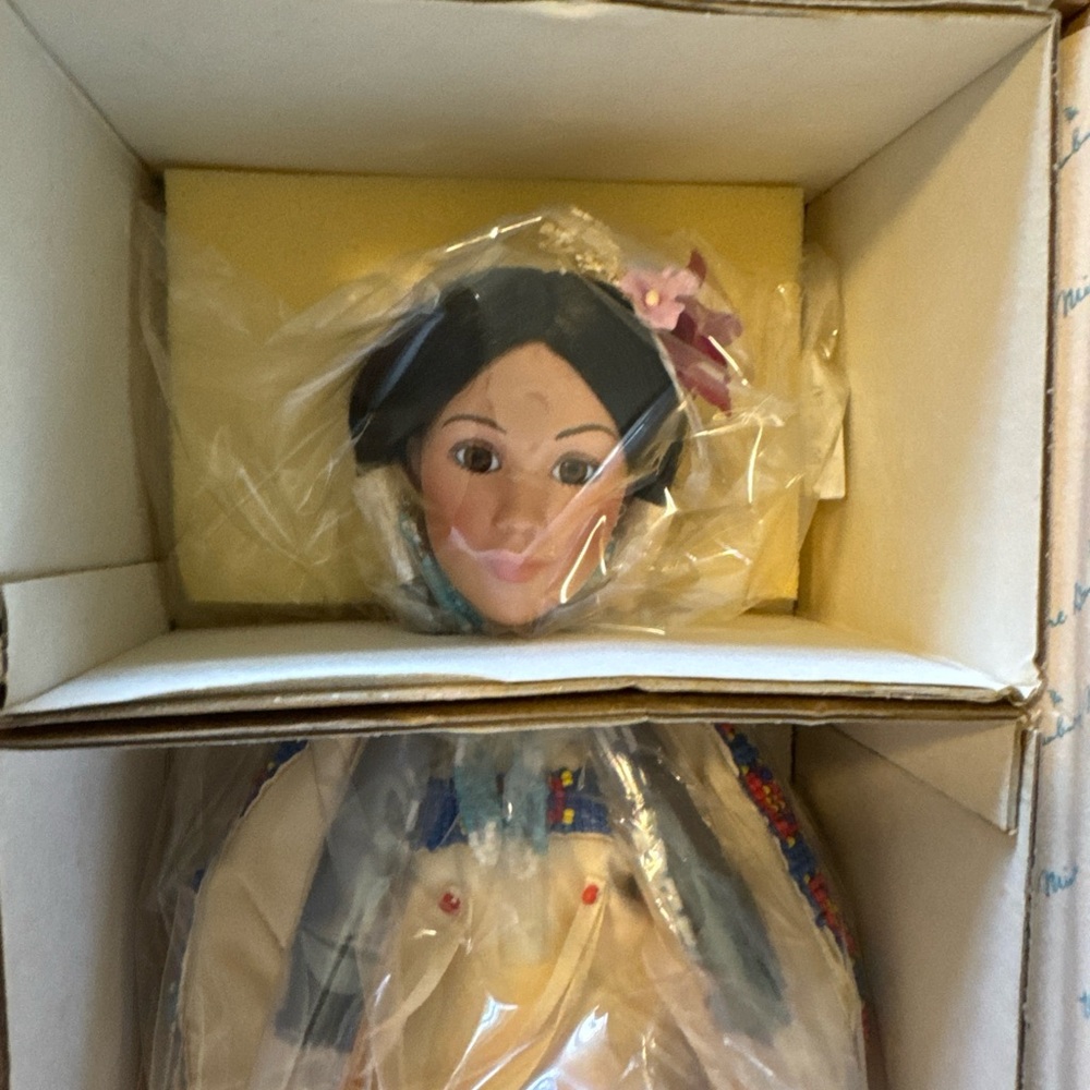 Decorative Doll with Floral Accents